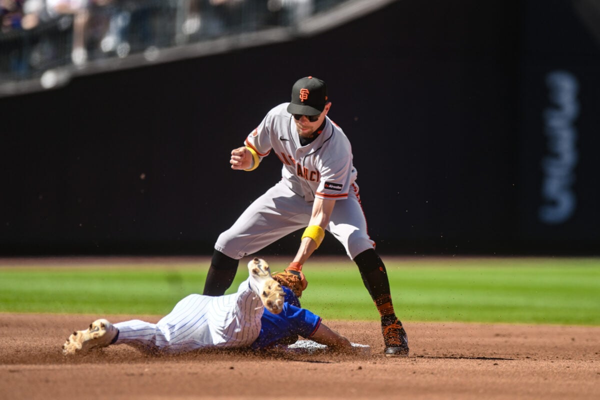 Sep 6, 2026; New York City, New York, USA;  San Francisco Giants shortstop Christian Koss (50) tags out New York Mets left fielder Nick Morabito (55) during a steal attempt during the second inning at Citi Field.  Mandatory Credit: John Jones-Imagn Images