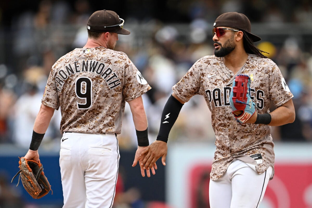 Sep 6, 2026; San Diego, California, USA; San Diego Padres right fielder Fernando Tatis Jr. (23), right, and second baseman Jake Cronenworth (9) celebrate after the Padres beat the New York Yankees at Petco Park. Mandatory Credit: Denis Poroy-Imagn Images