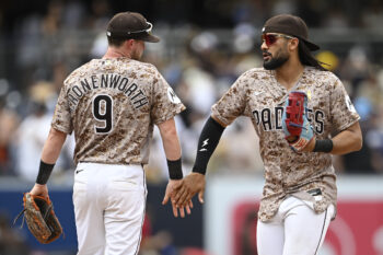 Sep 6, 2026; San Diego, California, USA;  San Diego Padres right fielder Fernando Tatis Jr. (23), right, and second baseman Jake Cronenworth (9) celebrate after the Padres beat the New York Yankees at Petco Park.  Mandatory Credit: Denis Poroy-Imagn Images