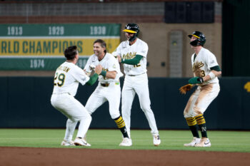 Sep 7, 2026; West Sacramento, California, USA;  Athletics infielder Jeff McNeil (22) celebrates with teammates after hitting a walk-off infield RBI single against Toronto Blue Jays pitcher Louis Varland (not pictured) during the ninth inning at Sutter Health Park.  Mandatory Credit: Dennis Lee-Imagn Images