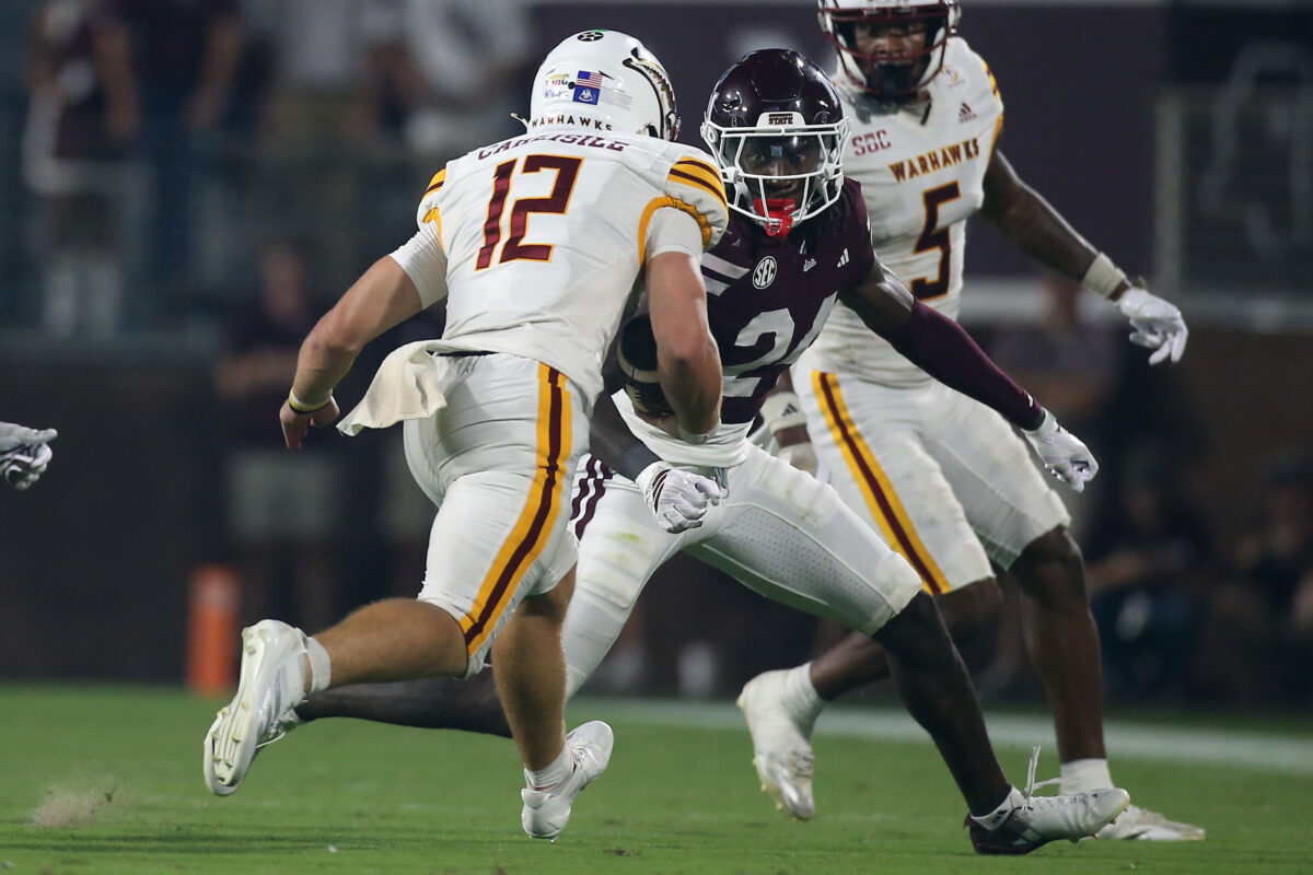 Sep 5, 2026; Starkville, Mississippi, USA; Mississippi State Bulldogs cornerback Quentin Taylor (24) attempts to tackle Louisiana Monroe Warhawks quarterback Austin Carlisle (12) during the fourth quarter at Davis Wade Stadium at Scott Field. Mandatory Credit: Petre Thomas-Imagn Images