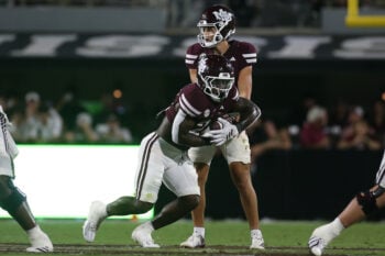 Sep 5, 2026; Starkville, Mississippi, USA; Mississippi State Bulldogs quarterback Parker Puckett (15) hands the ball off to running back J.J. Hill (21) during the fourth quarter against the Louisiana Monroe Warhawks  at Davis Wade Stadium at Scott Field. Mandatory Credit: Petre Thomas-Imagn Images