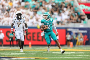 Sep 5, 2026; Morgantown, West Virginia, USA; Coastal Carolina Chanticleers quarterback Deuce Bailey (2) runs the ball during the third quarter against the West Virginia Mountaineers at Milan Puskar Stadium. Mandatory Credit: Ben Queen-Imagn Images