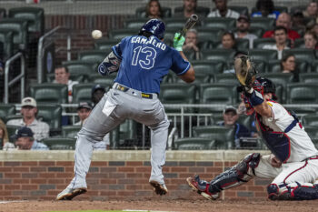 Sep 8, 2026; Cumberland, Georgia, USA; Tampa Bay Rays third baseman Junior Caminero (13) is hit by a pitch against the Atlanta Braves during the eighth inning at Truist Park. Mandatory Credit: Dale Zanine-Imagn Images