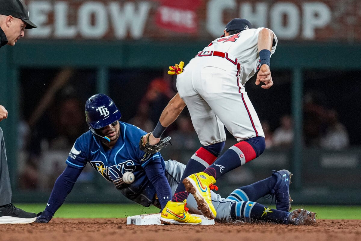 Sep 8, 2026; Cumberland, Georgia, USA; Tampa Bay Rays right fielder Victor Mesa Jr. (25) steals second base behind Atlanta Braves shortstop Mauricio Dubon (14) during the third inning at Truist Park. Mandatory Credit: Dale Zanine-Imagn Images