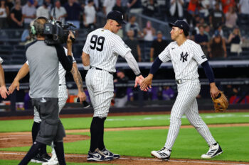 Sep 9, 2026; Bronx, New York, USA;  New York Yankees right fielder Aaron Judge (99) and shortstop George Lombard Jr. (96) celebrate after defeating the Colorado Rockies at Yankee Stadium.  Mandatory Credit: Vincent Carchietta-Imagn Images