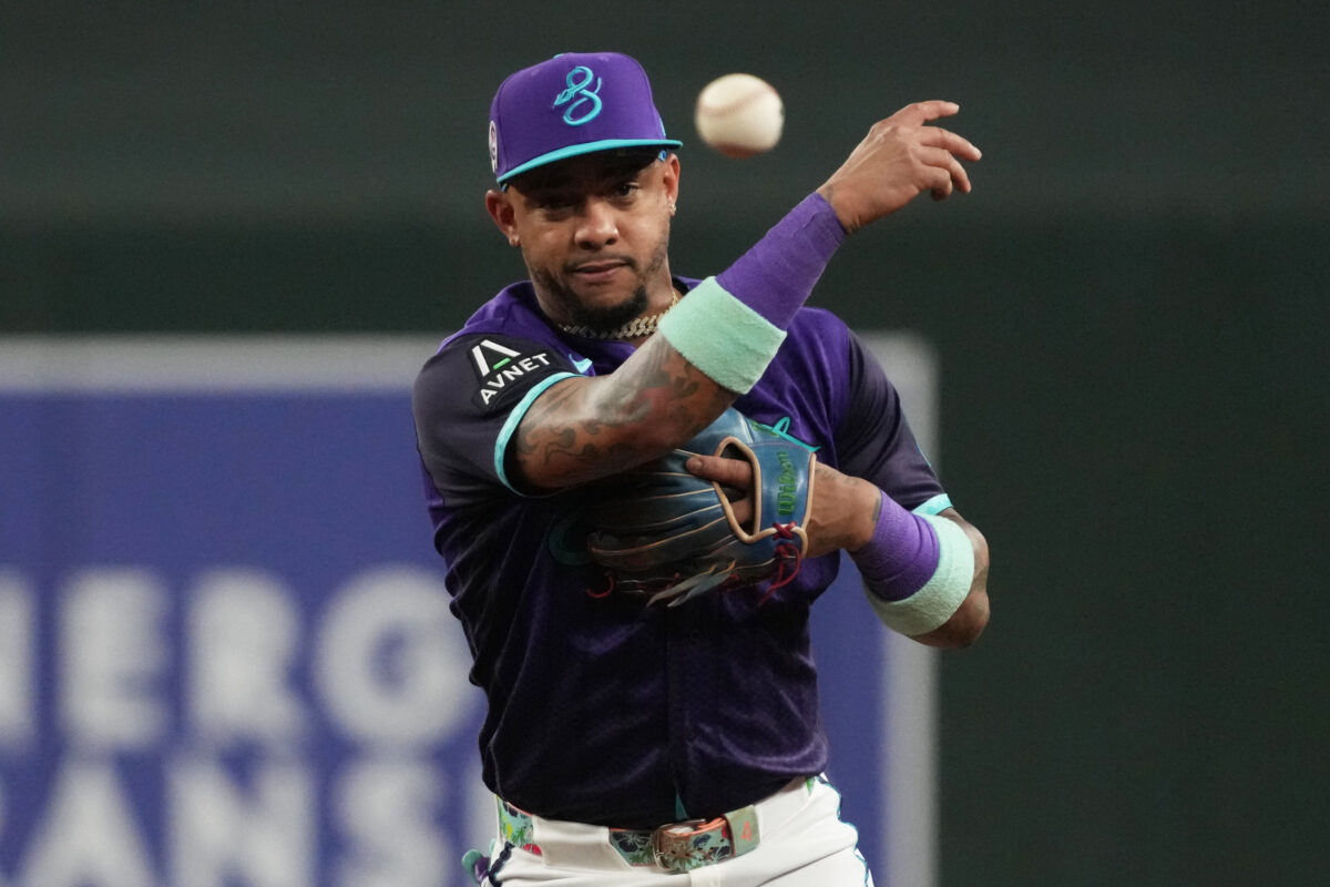 Sep 11, 2026; Phoenix, Arizona, USA;  Arizona Diamondbacks second baseman Ketel Marte (4) makes the play against the Texas Rangers in the third inning at Chase Field.  Mandatory Credit: Rick Scuteri-Imagn Images