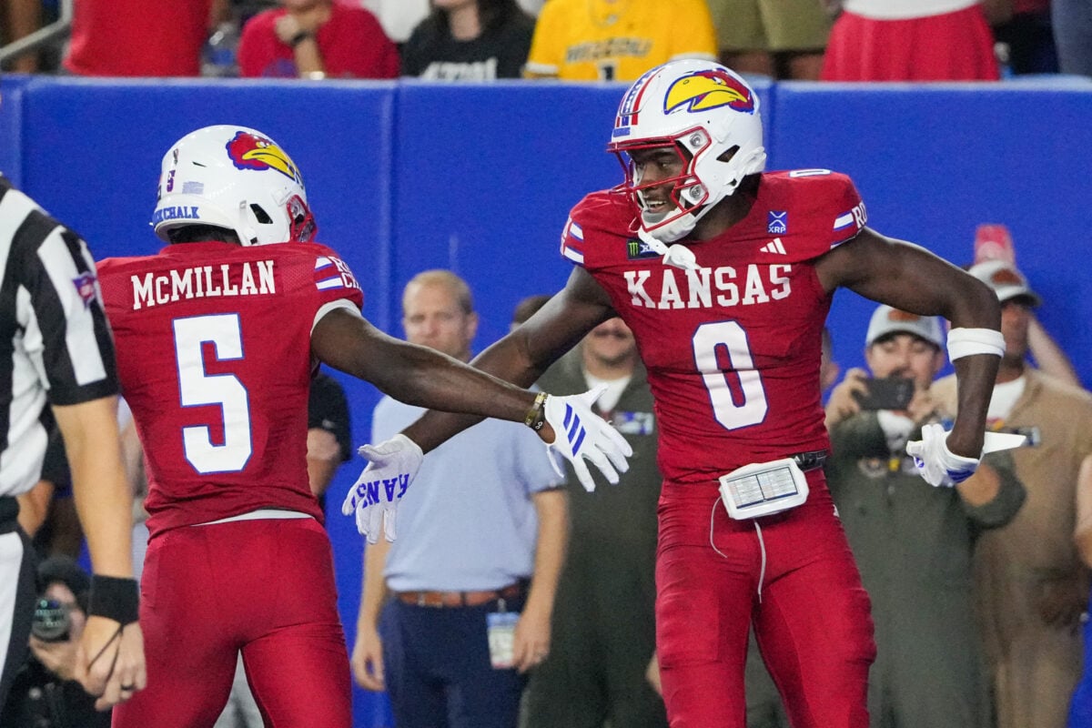 Sep 11, 2026; Lawrence, Kansas, USA; Kansas Jayhawks wide receiver Nahzae Cox (0) celebrates with wide receiver Nik McMillan (5) against the Missouri Tigers during the second half of the game at David Booth Kansas Memorial Stadium. Mandatory Credit: Denny Medley-Imagn Images