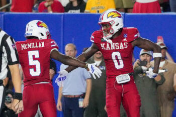 Sep 11, 2026; Lawrence, Kansas, USA; Kansas Jayhawks wide receiver Nahzae Cox (0) celebrates with wide receiver Nik McMillan (5) against the Missouri Tigers during the second half of the game at David Booth Kansas Memorial Stadium. Mandatory Credit: Denny Medley-Imagn Images