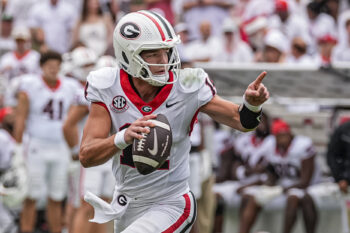 Sep 12, 2026; Athens, Georgia, USA;  Georgia Bulldogs quarterback Gunner Stockton (14) rolls out and runs against the Western Kentucky Hilltoppers during the first half at Sanford Stadium.  Mandatory Credit: Dale Zanine-Imagn Images