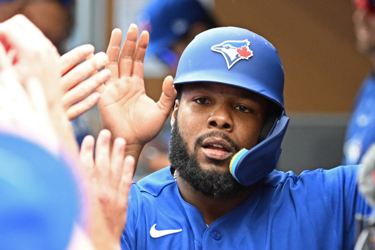 Sep 12, 2026; Toronto, Ontario, CAN;  Toronto Blue Jays first baseman Vladimir Guerrero Jr. (27) celebrates with team mates in the dugout after scoring a run against the Baltimore Orioles in the first inning at Rogers Centre.  Mandatory Credit: Dan Hamilton-Imagn Images