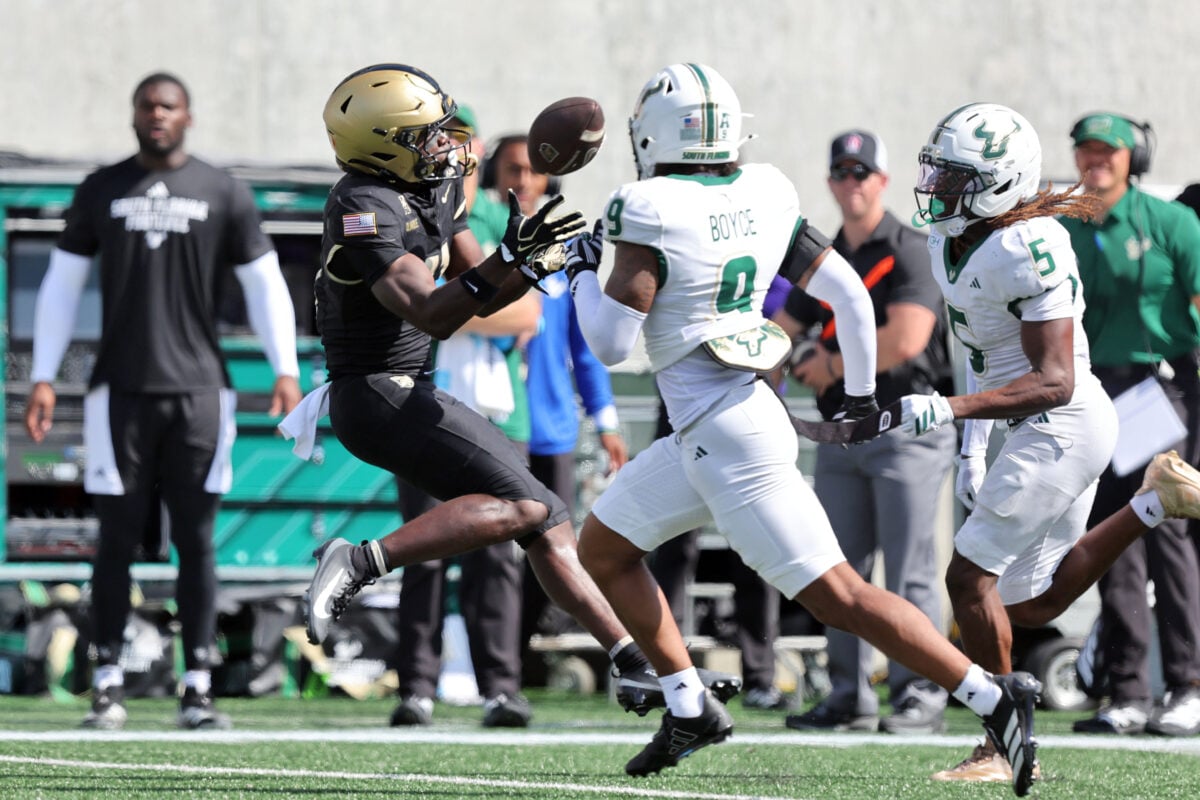 Sep 12, 2026; West Point, New York, USA; Army Black Knights wide receiver Tobi Olawole (11) catches a pass behind South Florida Bulls safety Israel Boyce (9) during the second half at Michie Stadium. Mandatory Credit: Danny Wild-Imagn Images