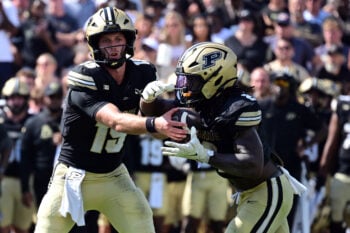 Sep 12, 2026; West Lafayette, Indiana, USA;  Purdue Boilermakers quarterback Ryan Browne (15) hands the ball off to running back Fame Ijeboi (2) during the second half against the Wake Forest Demon Deacons at Ross-Ade Stadium.  Mandatory Credit: Marc Lebryk-Imagn Images