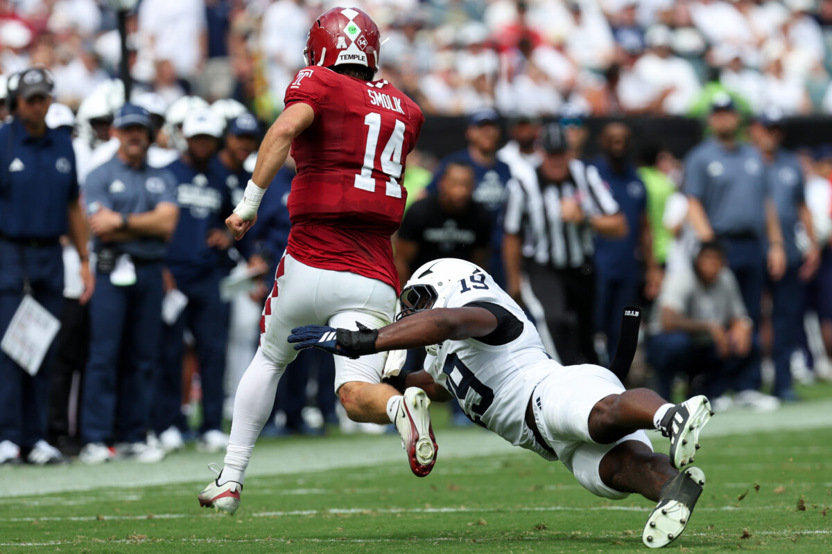 Sep 12, 2026; Philadelphia, Pennsylvania, USA; Penn State Nittany Lions defensive end Yvan Kemajou (19) attempts to tackle Temple Owls quarterback Jaxon Smolik (14) during the second quarter at Lincoln Financial Field. Mandatory Credit: Matthew O'Haren-Imagn Images