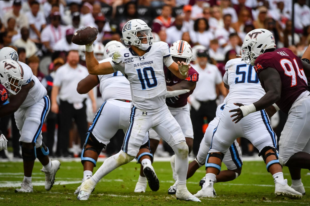 Sep 12, 2026; Blacksburg, Virginia, USA; Old Dominion Monarchs quarterback Quinn Henicle (10) throws a pass as Virginia Tech Hokies defensive lineman Elhadj Fall (94) rushes during the third quarter at Lane Stadium. Mandatory Credit: Brian Bishop-Imagn Images