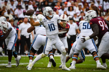 Sep 12, 2026; Blacksburg, Virginia, USA;  Old Dominion Monarchs quarterback Quinn Henicle (10) throws a pass as Virginia Tech Hokies defensive lineman Elhadj Fall (94) rushes during the third quarter at Lane Stadium.  Mandatory Credit: Brian Bishop-Imagn Images