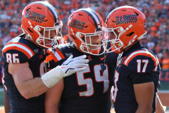 Sep 12, 2026; Champaign, Illinois, USA;  Illinois Fighting Illini tight end Christian Abney (86) and Jake Renfro (59) react with wide receiver Collin Dixon (17) after he scored a touchdown during the first half at against the Duke Blue Devils at Gies Memorial Stadium.  Mandatory Credit: Ron Johnson-Imagn Images