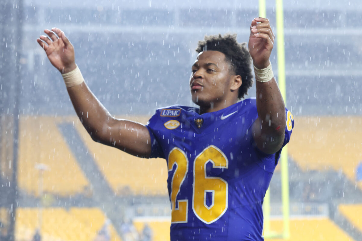 Sep 12, 2026; Pittsburgh, Pennsylvania, USA;  Pittsburgh Panthers running back Damon Ferguson Jr. (26) leads the band in the Victory Song in a downpour after the Panthers defeated the UCF Knights at Acrisure Stadium.  Mandatory Credit: Charles LeClaire-Imagn Images
