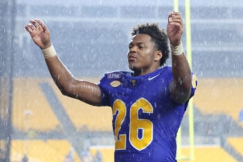 Sep 12, 2026; Pittsburgh, Pennsylvania, USA;  Pittsburgh Panthers running back Damon Ferguson Jr. (26) leads the band in the Victory Song in a downpour after the Panthers defeated the UCF Knights at Acrisure Stadium.  Mandatory Credit: Charles LeClaire-Imagn Images