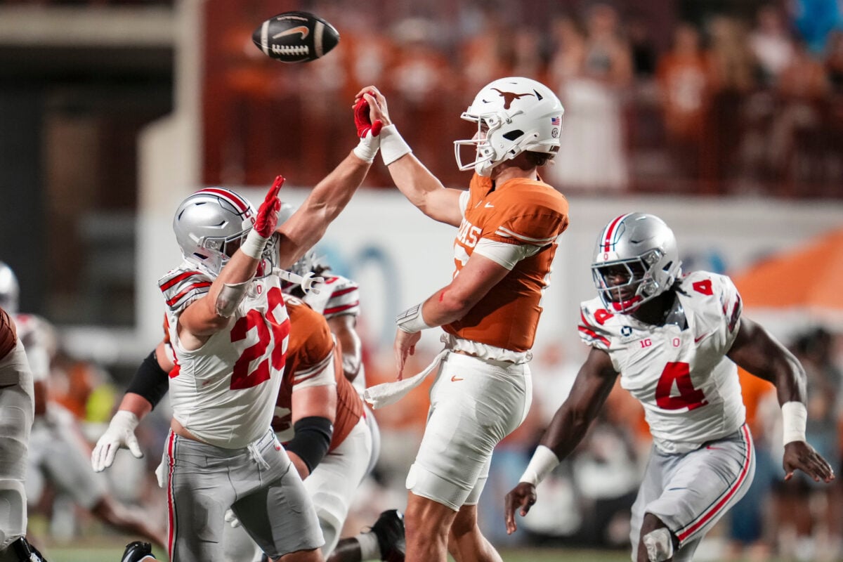 Ohio State Buckeyes linebacker Payton Pierce (26) disrupts a pass attempt by Texas Longhorns quarterback Arch Manning (16) during the NCAA football game at Darrell K Royal–Texas Memorial Stadium in Austin, Texas on Sept. 12, 2026. Texas won 24-23.