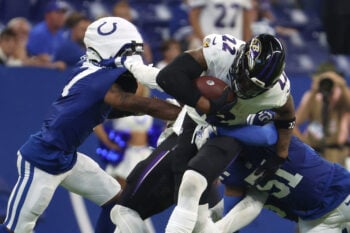 Sep 13, 2026; Indianapolis, Indiana, USA;  Baltimore Ravens running back Derrick Henry (22) runs with the ball against the Indianapolis Colts during the second half at Lucas Oil Stadium.  Mandatory Credit: Trevor Ruszkowski-Imagn Images