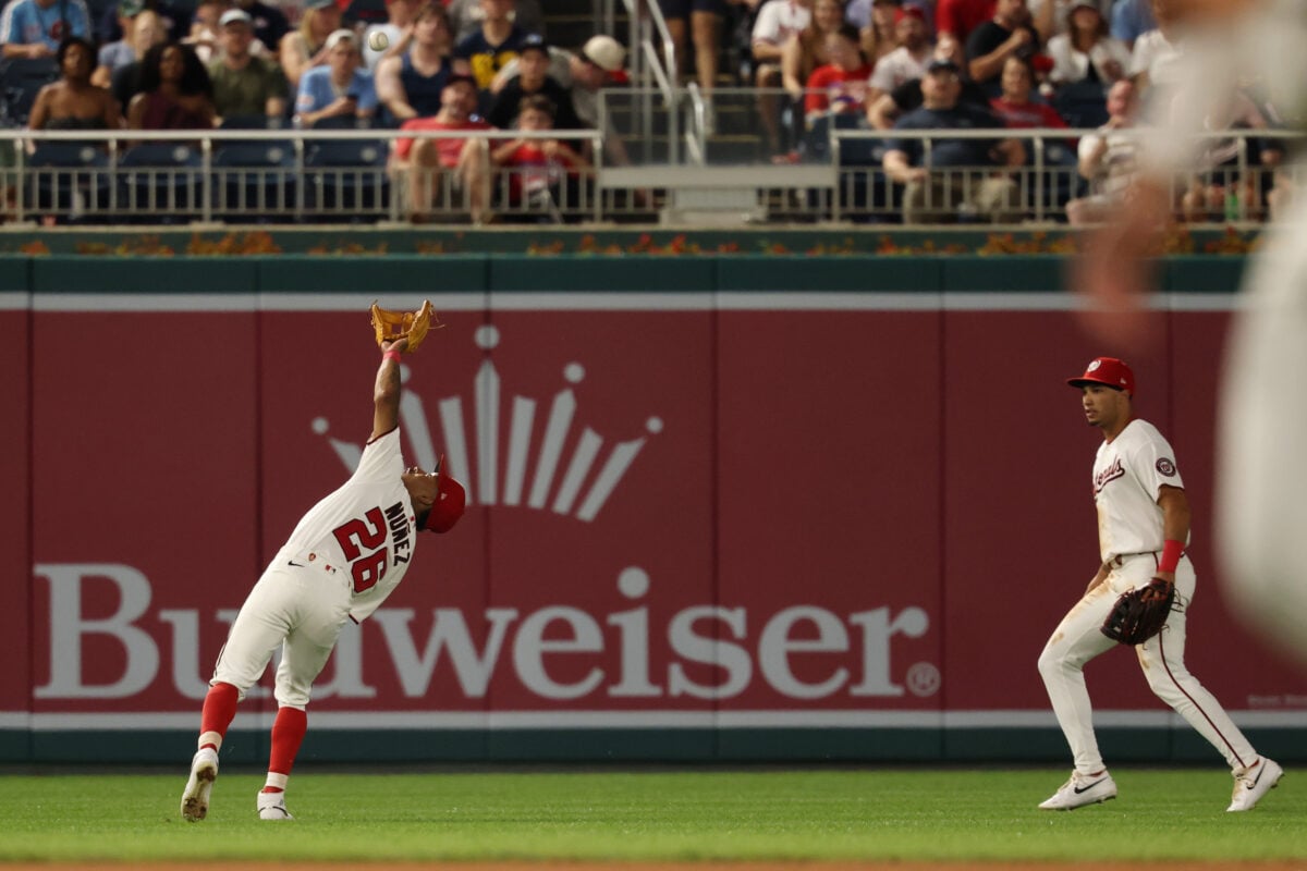 Sep 16, 2026; Washington, District of Columbia, USA; Washington Nationals second baseman Nasim Nuñez (26) reaches to catch a pop up by Philadelphia Phillies shortstop Trea Turner (not pictured) during the seventh inning at Nationals Park. Mandatory Credit: Geoff Burke-Imagn Images