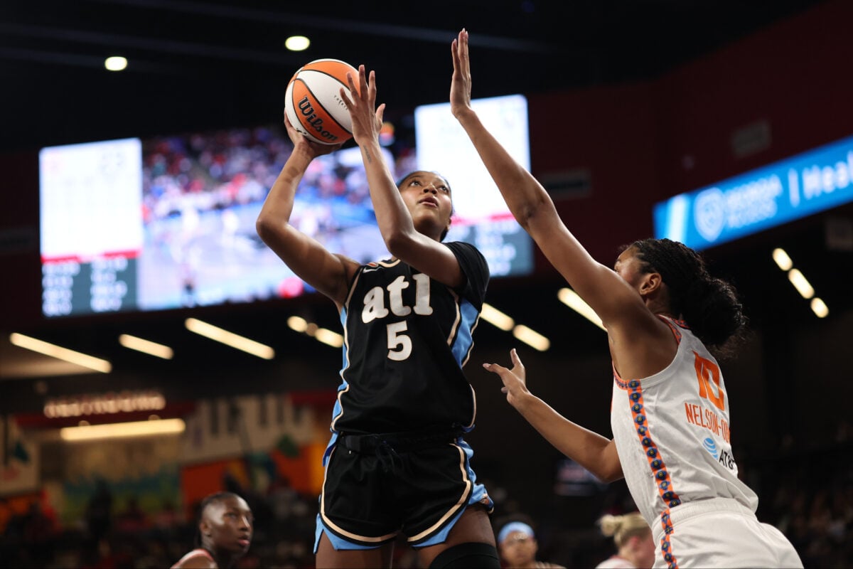 Sep 17, 2026; College Park, Georgia, USA;  Atlanta Dream forward Angel Reese (5) drives to the hoop past Connecticut Sun center Olivia Nelson-Ododa (10) during the second quarter at Gateway Center Arena at College Park.  Mandatory Credit: Brett Davis-Imagn Images