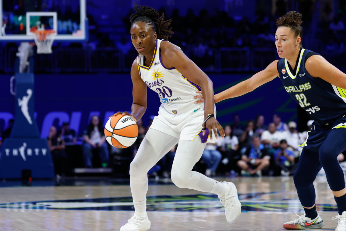Sep 17, 2026; Arlington, Texas, USA;  Los Angeles Sparks forward Nneka Ogwumike (30) dribbles against Dallas Wings forward Jessica Shepard (32) during the first half at College Park Center.  Mandatory Credit: Chris Jones-Imagn Images