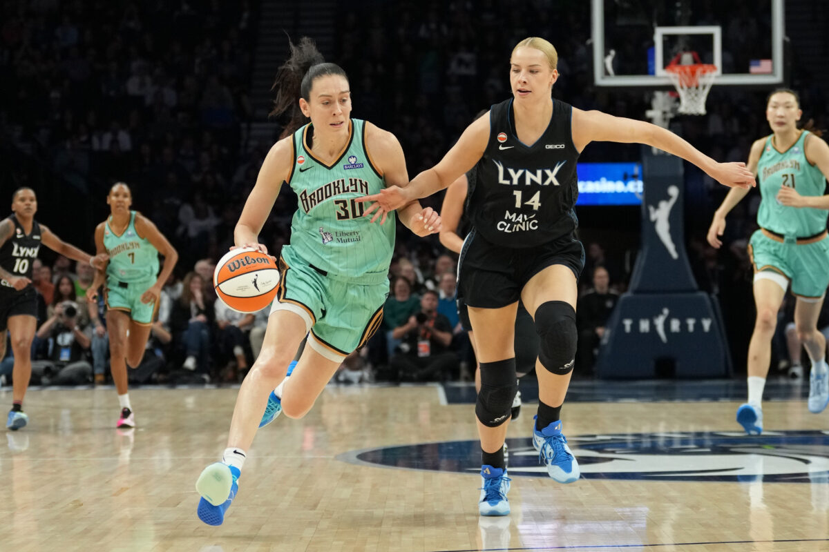 Sep 18, 2026; Minneapolis, Minnesota, USA;  New York Liberty forward Breanna Stewart (30) dribbles the ball past Minnesota Lynx forward Dorka Juhasz (14) in the first half at Target Center.  Mandatory Credit: Jesse Johnson-Imagn Images