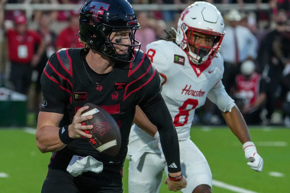 Texas Tech's Will Hammond rolls out for the pass against Houston during a Big 12 Conference football game, Friday, Sept. 18, 2026, at Galaxy Stadium.