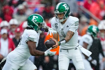 Sep 19, 2026; Madison, Wisconsin, USA;  Eastern Michigan Eagles quarterback Noah Kim (1) hands the football to running back Amareon Blue (15) during the second quarter against the Wisconsin Badgers at Camp Randall Stadium. Mandatory Credit: Jeff Hanisch-Imagn Images