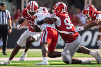 Indiana's Tyrique Tucker (95) and Jamari Sharpe (22) tackle Western Kentucky's Ajay Allen (3) during the Indiana versus Western Kentucky football game at Memorial Stadium on Saturday, Sept. 19, 2026.