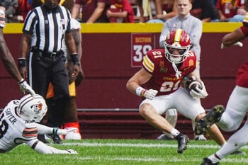 Iowa State punt returner Aiden Flora (21) breaks a tackle attempt by Bowling Green Falcons special team player Nick Sawyer (18) during a first-quarter punt return on Sept. 19, 2026, at Jack Trice Stadium in Ames, Iowa.