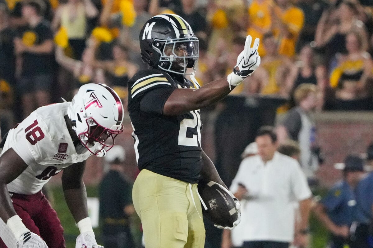 Sep 19, 2026; Columbia, Missouri, USA; Missouri Tigers running back Jamal Roberts (20) celebrates after a run against the Troy Trojans during the second half of the game at Faurot Field at Memorial Stadium. Mandatory Credit: Denny Medley-Imagn Images