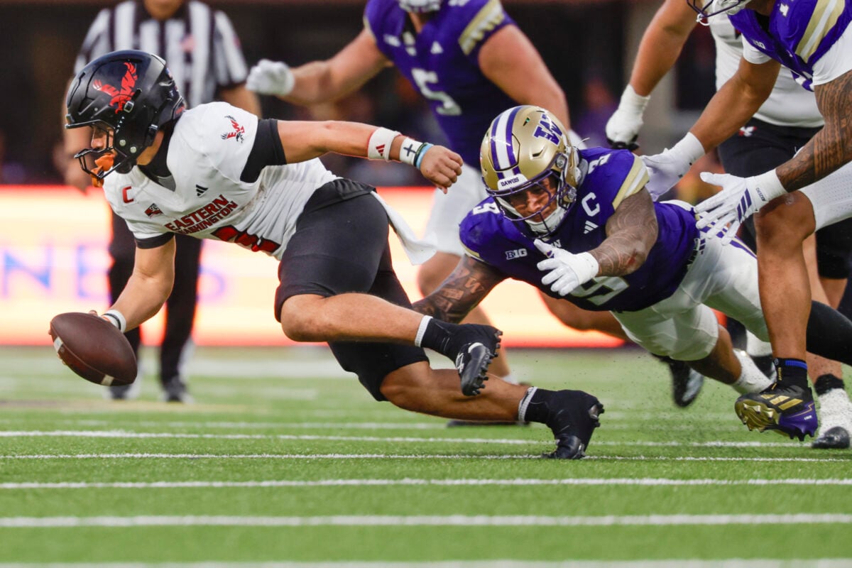 Sep 19, 2026; Seattle, Washington, USA; Washington Huskies linebacker Jacob Manu (9) sacks Eastern Washington Eagles quarterback Nate Bell (2) during the fourth quarter at Husky Stadium. Mandatory Credit: Joe Nicholson-Imagn Images