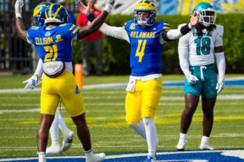Delaware’s Viron Ellison Jr. (left) and quarterback Nick Minicucci celebrate as time runs out in the Hens’ 22-15 win at Delaware Stadium, Sept. 19, 2026.