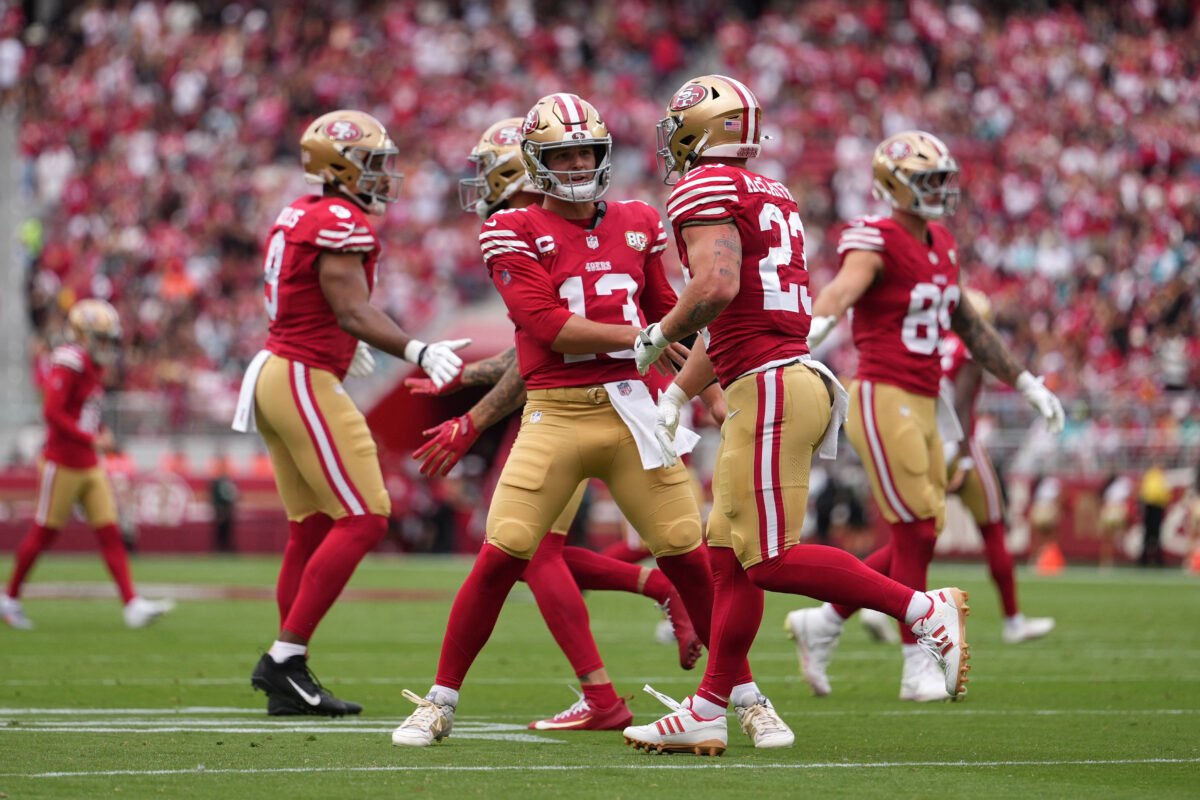 Sep 20, 2026; Santa Clara, California, USA; San Francisco 49ers running back Christian McCaffrey (23) celebrates with quarterback Brock Purdy (13) after scoring a touchdown in the first quarter against the Miami Dolphins at Levi's Stadium. Mandatory Credit: Cary Edmondson-Imagn Images