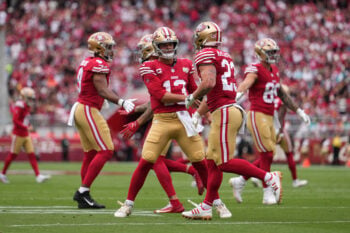 Sep 20, 2026; Santa Clara, California, USA;  San Francisco 49ers running back Christian McCaffrey (23) celebrates with quarterback Brock Purdy (13) after scoring a touchdown in the first quarter against the Miami Dolphins at Levi's Stadium.  Mandatory Credit: Cary Edmondson-Imagn Images