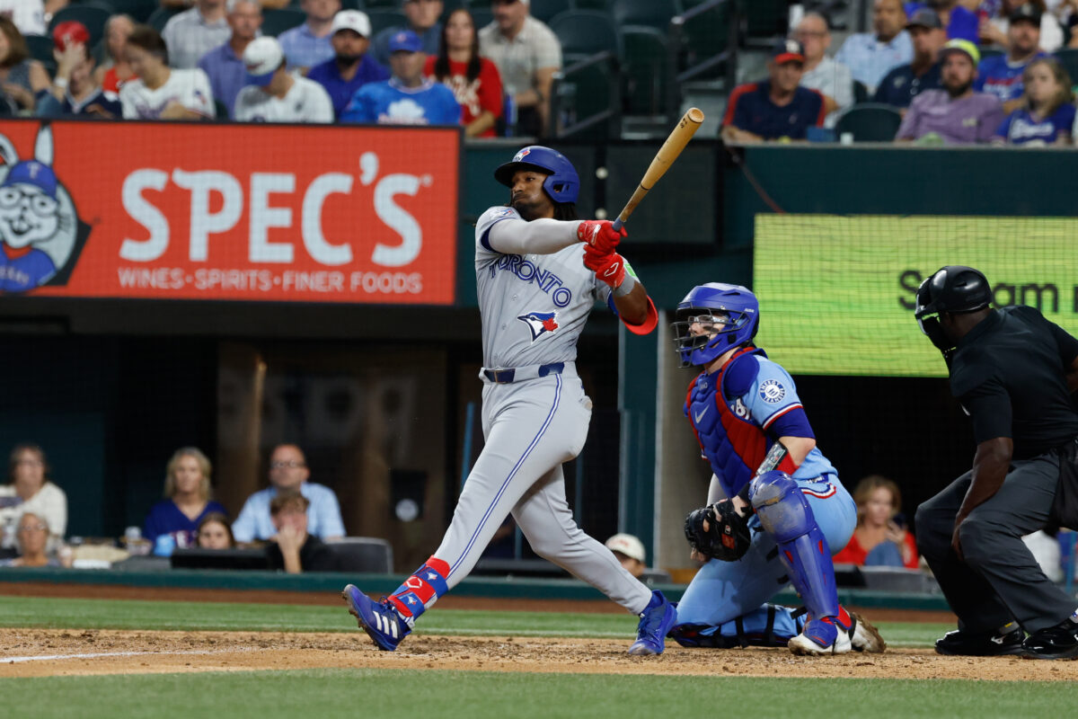 Sep 20, 2026; Arlington, Texas, USA;  Toronto Blue Jays batter Charles McAdoo swings during the seventh inning against the Texas Rangers at Globe Life Field.  Mandatory Credit: Chris Jones-Imagn Images