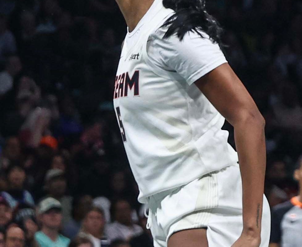 Sep 21, 2026; Brooklyn, New York, USA;  Atlanta Dream forward Angel Reese (5) reacts after scoring in the first quarter against the New York Liberty at Barclays Center. Mandatory Credit: Wendell Cruz-Imagn Images