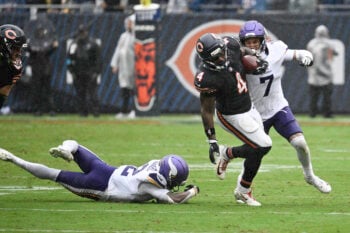 Sep 20, 2026; Chicago, Illinois, USA; Chicago Bears running back D'Andre Swift (4) runs against Minnesota Vikings cornerback Byron Murphy Jr. (7) during the second half at Soldier Field. Mandatory Credit: Matt Marton-Imagn Images