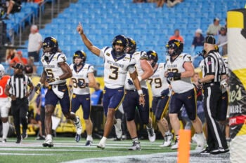 Sep 19, 2026; Charlotte, North Carolina, USA; West Virginia Mountaineers quarterback Michael Hawkins Jr. (3) celebrates after a touchdown during the second quarter Virginia Cavaliers at Bank of America Stadium. Mandatory Credit: Ben Queen-Imagn Images