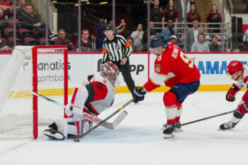 Sep 22, 2026; Raleigh, North Carolina, USA;  Carolina Hurricanes goalie Cayden Primeau (55) stops the overtime shot by Florida Panthers center Sam Bennett (9) during the overtime at Lenovo Center.  Mandatory Credit: James Guillory-Imagn Images