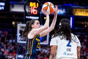 Sep 22, 2026; Indianapolis, Indiana, USA;  Indiana Fever guard Caitlin Clark (22) shoots the ball while Minnesota Lynx forward Liatu King (2) defends in the second half at Gainbridge Fieldhouse.  Mandatory Credit: Trevor Ruszkowski-Imagn Images