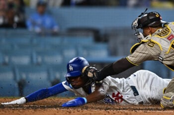 Sep 22, 2026; Los Angeles, California, USA;  Los Angeles Dodgers designated hitter Josue De Paula (95) is tagged out at home by San Diego Padres catcher Luis Campusano (12) during the sixth inning at Dodger Stadium.  Mandatory Credit: William Liang-Imagn Images