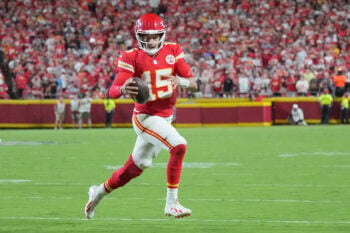 Sep 14, 2026; Kansas City, Missouri, USA; Kansas City Chiefs quarterback Patrick Mahomes (15) scrambles in the backfield against the Denver Broncos during the game at GEHA Field at Arrowhead Stadium. Mandatory Credit: Denny Medley-Imagn Images