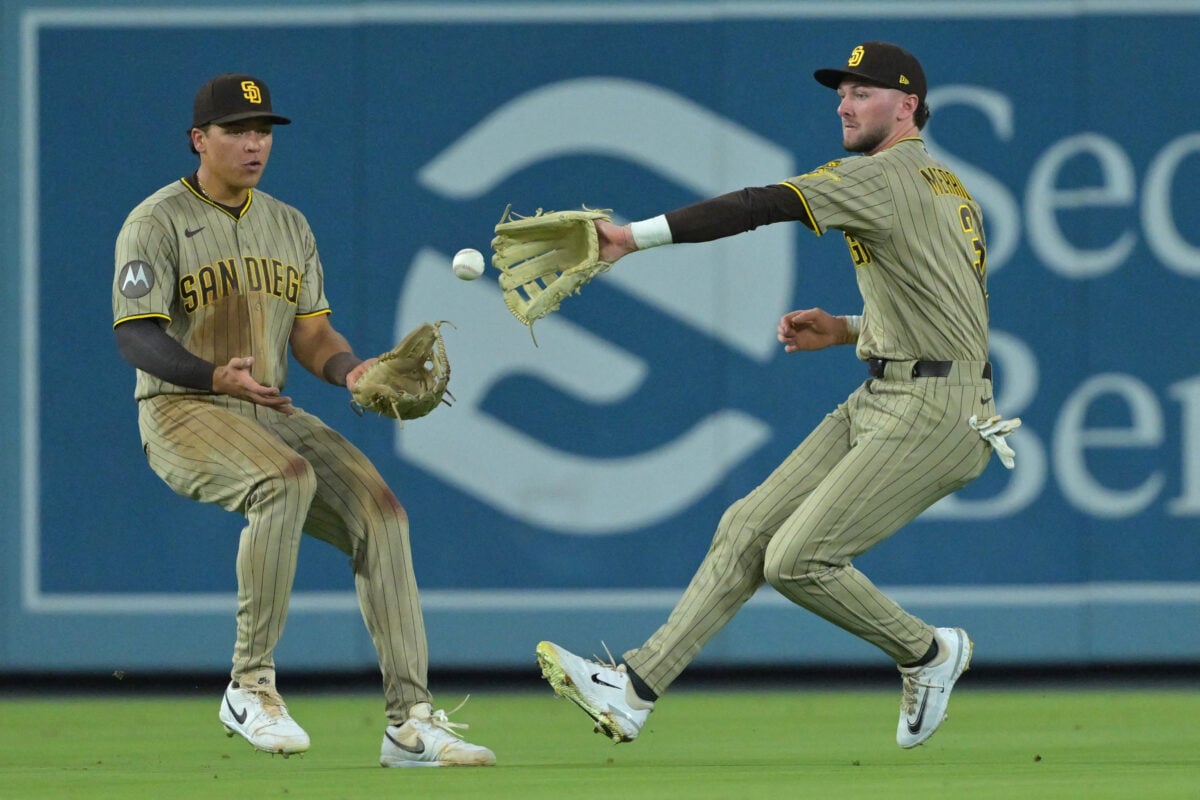 Sep 23, 2026; Los Angeles, California, USA;  San Diego Padres left fielder Duston Harris (29) and center fielder Jackson Merrill (3) chase down a single by Los Angeles Dodgers right fielder Kyle Tucker (23) in the fourth inning against the San Diego Padres at Dodger Stadium. Mandatory Credit: Jayne Kamin-Oncea-Imagn Images