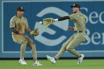 Sep 23, 2026; Los Angeles, California, USA;  San Diego Padres left fielder Duston Harris (29) and center fielder Jackson Merrill (3) chase down a single by Los Angeles Dodgers right fielder Kyle Tucker (23) in the fourth inning against the San Diego Padres at Dodger Stadium. Mandatory Credit: Jayne Kamin-Oncea-Imagn Images