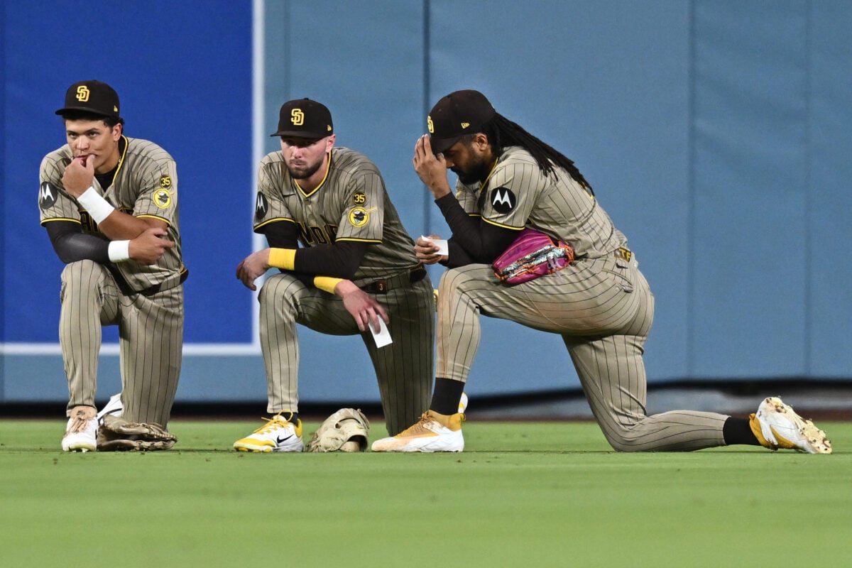 Sep 24, 2026; Los Angeles, California, USA;  San Diego Padres outfield meet during the fifth inning against the Los Angeles Dodgers at Dodger Stadium.  Mandatory Credit: William Liang-Imagn Images