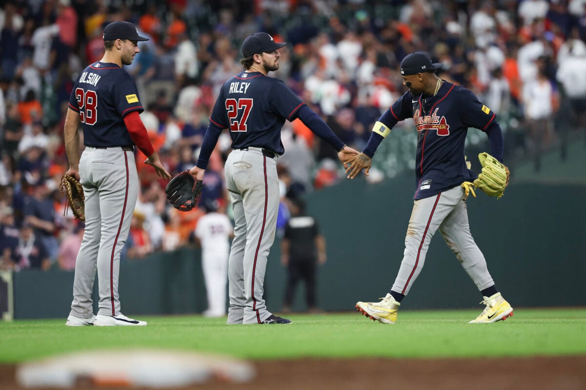 Sep 19, 2026; Houston, Texas, USA; Atlanta Braves right fielder Ronald Acuna Jr. (13) celebrates with Atlanta Braves first baseman Matt Olson (28) and Atlanta Braves third baseman Austin Riley (27) after defeating the Houston Astros at Daikin Park. Mandatory Credit: Thomas Shea-Imagn Images